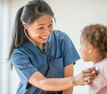 smiling nurse with child patient